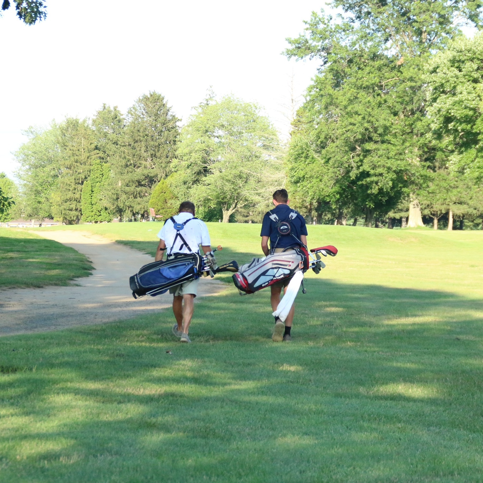 Two youth on the golf course.